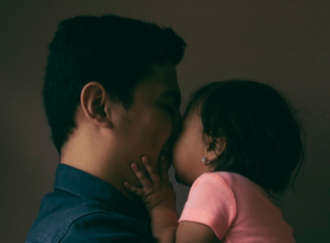 father holding daughter