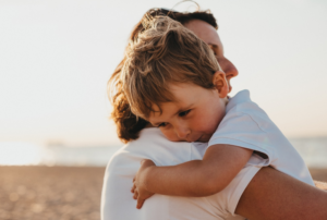 boy hugging mom