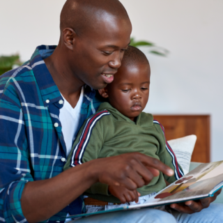 dad reading to his son